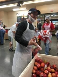 Bagging apples for families in need